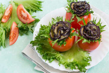 Tomatoes stuffed with cheese with eggplants in form of rose