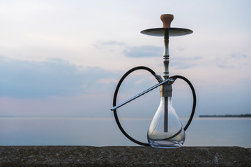 Hookah shisha smoke on beach background