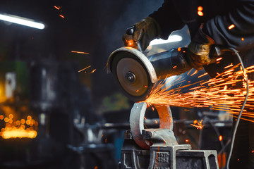 Working saws iron sparks