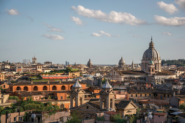 Fototapeta na wymiar Overview cathedrals domes and roofs of buildings in the sunset of Rome, the incredible city of the Ancient Era, known as 