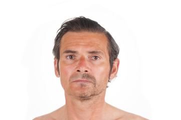 Portrait of sad adult man with half shaved face on white background