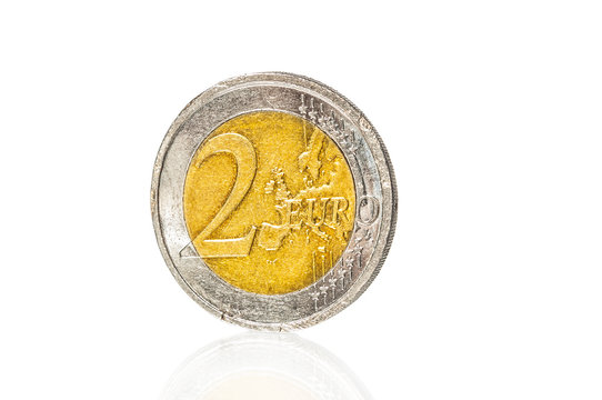 Old dirty euro coin close up on white background