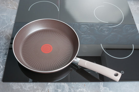 Empty frying pan on electric stove