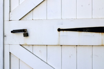 Padlock on the white door.