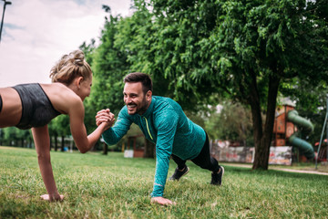 Couple exercising outdoors.