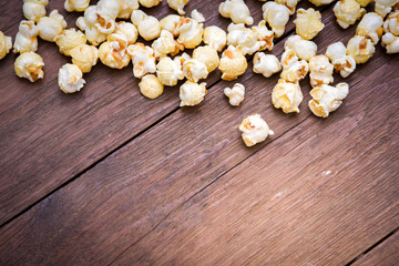 popcorn texture on a wooden table blackground