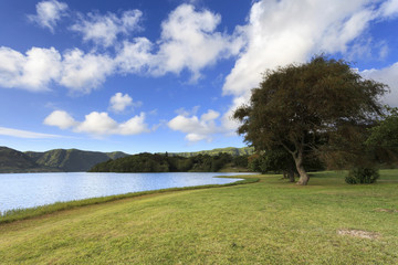 Panoramic landscape from Azores lagoons. The Azores archipelago has volcanic origin and the island of São Miguel has many lakes formed in craters of ancient volcanoes. The main tourist destination.