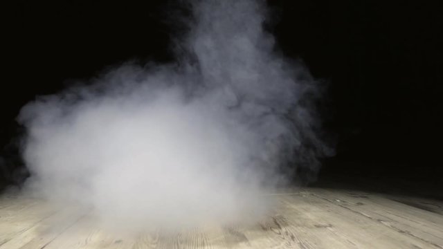 Smoke abstract. Smoke cloud. Smoke on black background in blue light. Smoke effect. Studio shot. Smoke machine. Fog background. Cigarette smoke