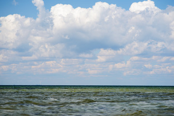 the blue ocean with dull clouds on a lovely sunny day