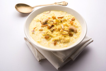 Rice pudding OR Kheer from India called also called Firnee. served in a bowl. Selective focus