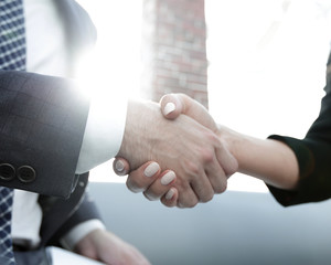 Close-up of two business people shaking hands