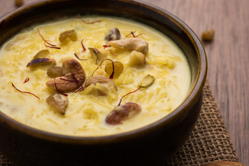 Indian sabzi / vegetable fried recipes served in white bowl over moody or colourful background. selective focus