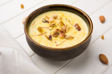 Indian sabzi / vegetable fried recipes served in white bowl over moody or colourful background. selective focus