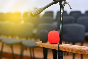 Microphone over the blurred business conference hall or seminar room, Blurred background