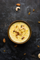 Rice pudding OR Kheer from India called also called Firnee. served in a bowl. Selective focus