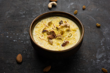 Indian sabzi / vegetable fried recipes served in white bowl over moody or colourful background. selective focus