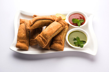 Sambar Vadi or Coriander pakora with ketchup and mint chutney