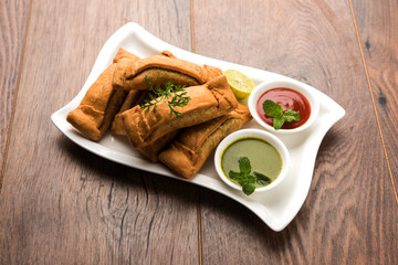 Sambar Vadi or Coriander pakora with ketchup and mint chutney