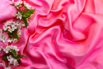 flowers on satin. silk fabric. wedding background.