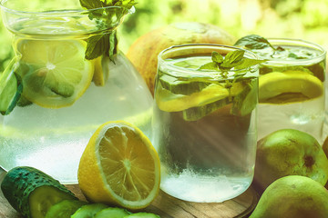 Detox water with cucumber and lemon. Pears and melons.