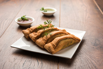 Sambar Vadi or Coriander pakora with ketchup and mint chutney