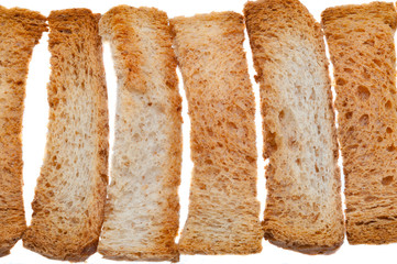 Bright fresh bread rolls made of white wheat bread on a white background.