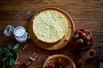 Delicious cake with fresh organic strawberries and mint, top view, close-up, selctive focus.
