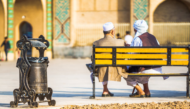 Two old man sitting on bench in Yazd - Iran