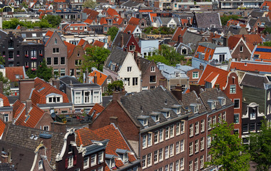 Roofs and facades of Amsterdam. City view from the bell tower of the church Westerkerk, Netherlands.
