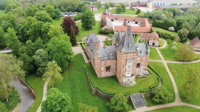 Aerial view of Trollenas Castle in spring, historic building near to Swedish town of Eslov - Scania, Sweden from above, Scandinavia, Europe