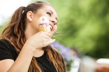 Young woman eating ice cream