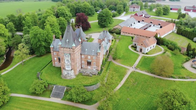 Aerial view of Trollenas Castle in spring, historic building near to Swedish town of Eslov - Scania, Sweden from above, Scandinavia, Europe