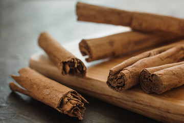 cinnamon sticks, on wooden in rustic style close up