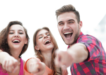 closeup of three young people showing hands forward