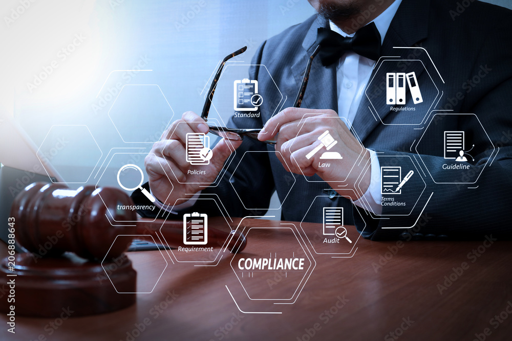 Poster justice and law concept.male judge in a courtroom with the gavel,working with smart phone,digital ta