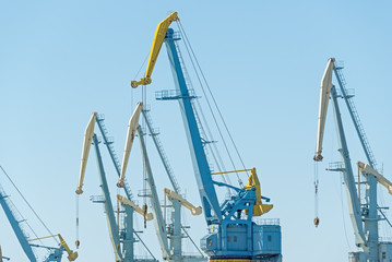 Fototapeta premium old port cranes on background sky