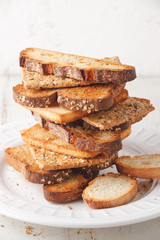 Assorted bread toasts in a stack