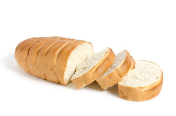 Bread on white background.The loaf is cut into pieces.