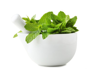 Fresh mint in mortar isolated on white