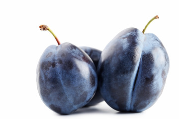Ripe plums isolated on white background