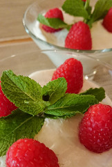 delicious fresh tiramisu with fresh raspberries and mint