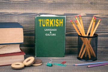 Turkish language and culture concept. Book on a wooden background