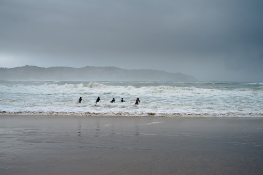 Surfers in Buffels Baai, South Africa