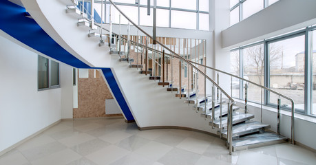 Large staircase in high-tech style in an office building