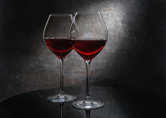 Two wine glass on dark