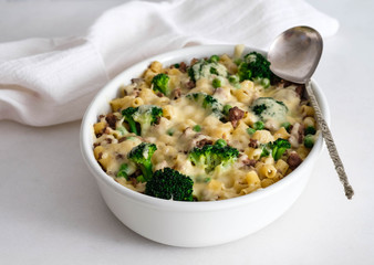 Casserole with pasta, chicken, broccoli and Bechamel sauce under a cheese crust