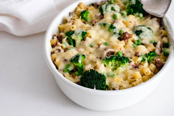 Casserole with pasta, chicken, broccoli and Bechamel sauce under a cheese crust