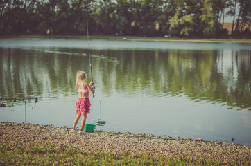 child fishing with fishing rod