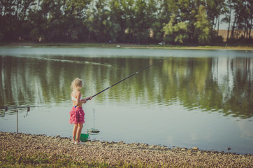 child fishing with fishing rod