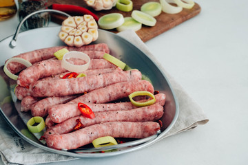 Grilled sausage with garlic and onions, greens.
